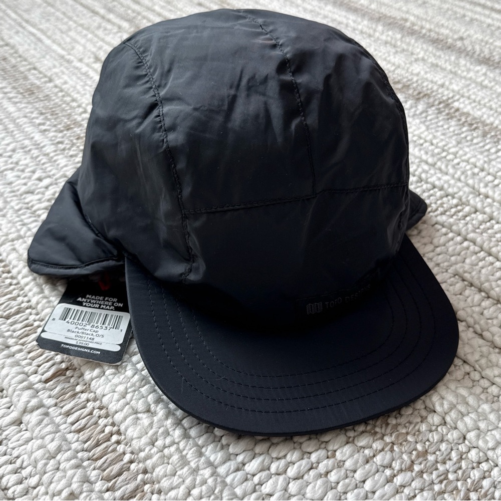 Topo designs puffer cap black one size fits most. NWT!!! Unisex hat ear flaps